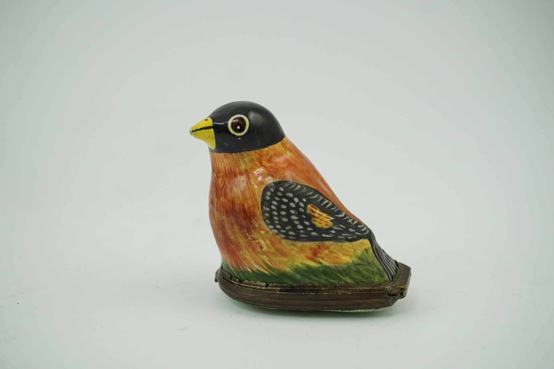 An 18th century South Staffordshire (Bilston) enamel box modelled as a bird with floral decorated cover, 4.5cm high. Condition - fair